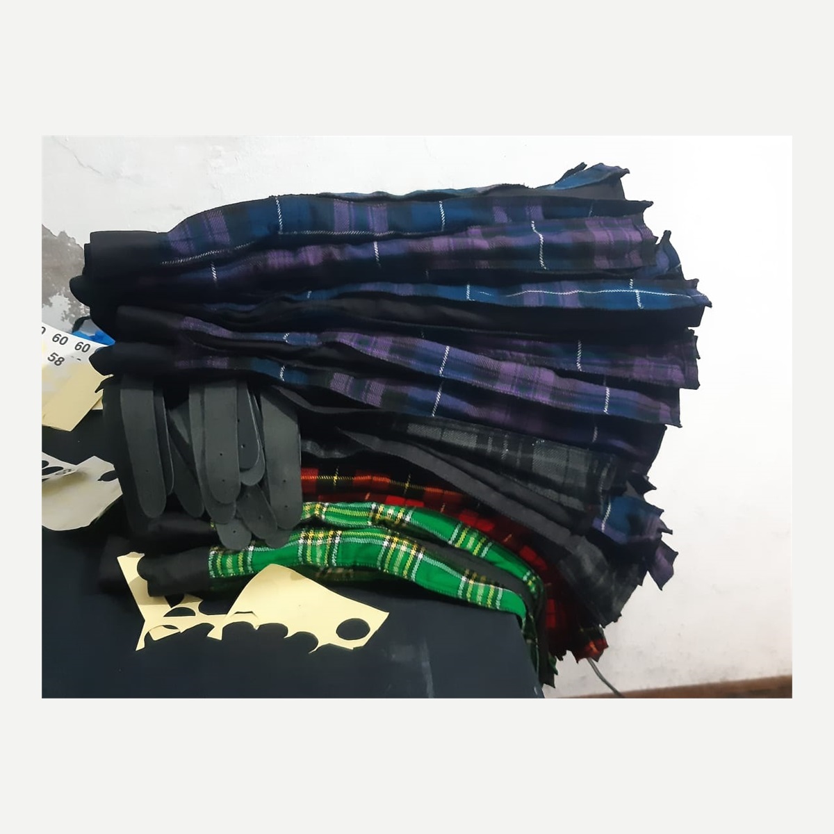 Assorted Folded Tartan Kilts Stack - assortment and stockroom - Al Wahab Global product reference