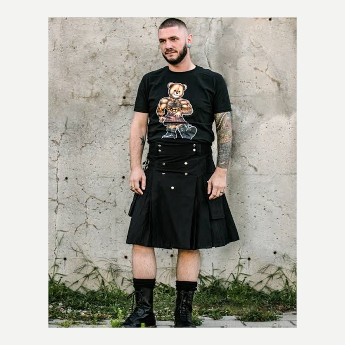 Black kilt shown on a model from the front - product photo reference